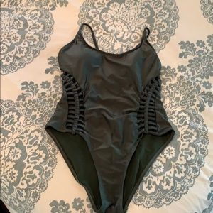 Green one piece bathing suit.